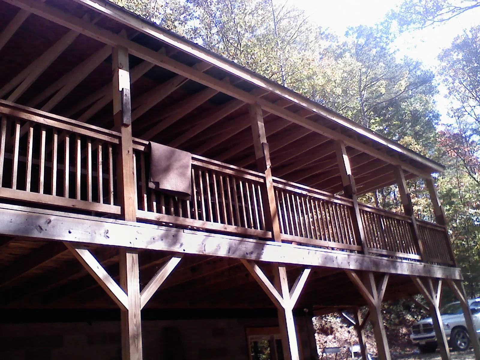 Timber framing under a new elevated porch and deck — Roof Leak Repair in Amber by Roofing Brothers